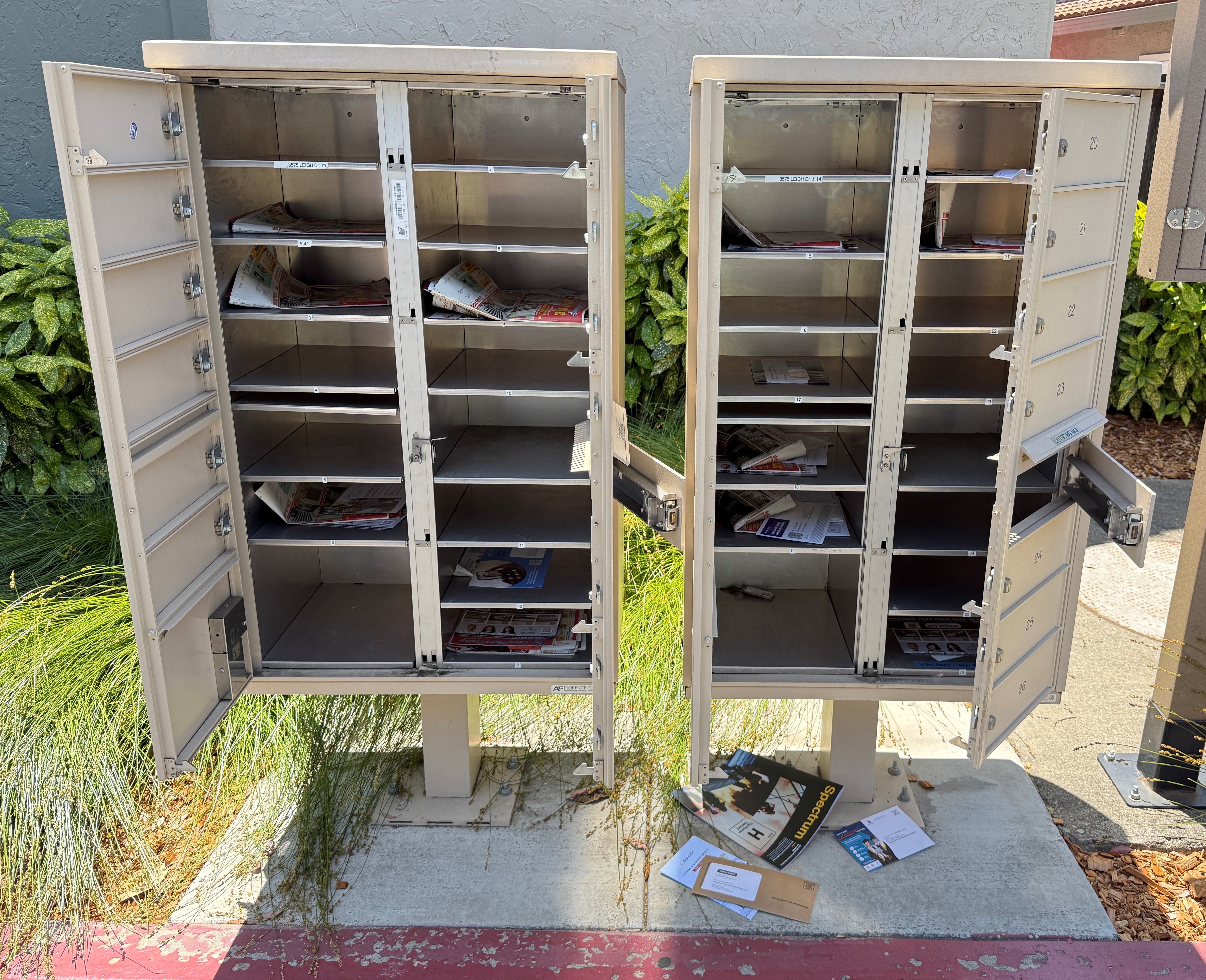 Wide-open cluster box unit after a mail theft